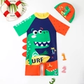 Maillot de bain enfant une pièce bleu avec motif dinosaure et bonnet de bain - 4Y / Bleu foncé
