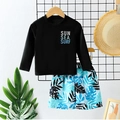 Two-piece boys swimwear featuring a long sleeve black top and tropical print trunks - Black