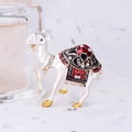 Enameled white alpaca jewelry box with red saddle and crystal accents on a sparkling base - Black