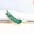 Elegant gold wheat brooch with green crystals and white pearl accent on book edge - Green