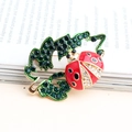Cartoon ladybug and green leaf brooch with crystals and red enamel on a gold base - Olive Green
