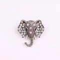 Sparkling elephant head brooch with clear rhinestones and black gem eyes in vintage silver - Silver