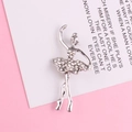 Detailed view of a silver-toned ballerina brooch with rhinestones on a card - Silver