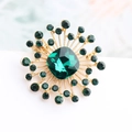 Spilla vintage a forma di sole con cristallo verde smeraldo e strass dorati brillanti - Stile Stella Verde Smeraldo (绿色)