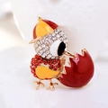 Macro view of a cute chick in eggshell brooch with colorful rhinestones and enamel detail - Yellow Red Chick (Style 5)