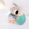 Close-up of a hatching chick brooch with colorful enamel and sparkling rhinestones - Pink Mint Green Bird (Style 7)