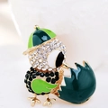 Macro shot of chick brooch with green enamel wings and sparkling crystal details - Green Dark Green Chick (Style 9)