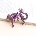 Exquisite purple enamel Chinese dragon brooch with detailed scales on vintage magazine background - Purple