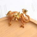 Exquisite golden dragon animal brooch pin featuring detailed textured scales and shine. - Gold