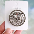 French Baroque style round brooch with grey crystals on display card - Antique Silver