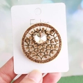 Baroque style gold brooch with central crystal and amber rhinestones on display card - Antique Gold