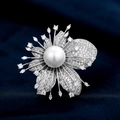 Elegant leaf floral brooch with round white pearl and micro-pave zircon on blue fabric - White