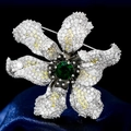 Luxurious flower brooch with green center stone and yellow zircon petals on silk - Silver