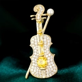 Elegant gold violin brooch with micro-paved zircons and yellow gemstone on velvet - Yellow Violin (TB572)