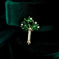 Macro shot of gold floral bouquet brooch with green marquise stones and zircon details - Green Bouquet Style (TC200)