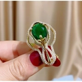 Elegant vintage pear-cut green gemstone brooch with gold floral frame and white zircons - Pear-shaped Green Main Stone Gold Flower Bud Style (TB1236)