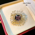 Macro detail of square purple crystal brooch with baguette-cut zircons in gold setting - Gold Vintage Square Purple Zircon Style (D169)