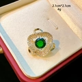 Macro detail of a 2.1cm heart brooch with emerald green stone and zircon inlay - Emerald Green Center Stone Heart Style (D152)