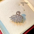 Macro detail of swan brooch featuring sparkling yellow crystals measuring 1.9cm by 1.8cm - Transparent Crystal Swan Style (D049)