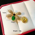 Elegant gold bee brooch with green stone and white zircon wings in a jewelry box - Green Stone Bee(C330)