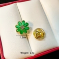 Macro shot of 1.3cm gold floral pin with green crystals and a butterfly clutch back - Green Petal Flower(C086)