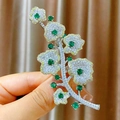 Luxurious floral branch brooch with white and yellow zircons and emerald stones - Silver Floral Branch (B1817)