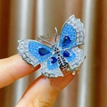 Elegante broche de mariposa vintage con piedras azules y cierre magnético plateado - Mariposa Azul (C326)