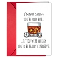 Close-up of humor card and red envelope showing whiskey illustration and witty quote - T020401258