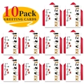 Close-up of 10-pack funny Christmas greeting cards with red envelopes and dog illustrations - Pet Back View Illustration Style