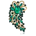Macro detail of vintage gold floral brooch featuring emerald green oval crystals - Green Gold Base (B311-E)