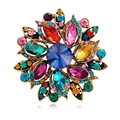 Retro flower brooch with a large blue crystal and colorful rhinestones in golden finish - Multicolor (B316-H)