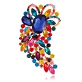 Detail view of colorful crystal brooch with a large blue gemstone and gold plating - Multicolor Gold Base (B311-H)