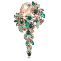 Vintage floral brooch in gold alloy with emerald green and amber crystals and rhinestones - Green
