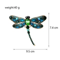 Dettaglio della spilla a libellula vintage in oro con strass verdi, altezza 7,4 cm - Verde Pavone