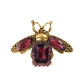 Macro view of vintage gold bee brooch with purple gemstone inlay and detailed craft - Purple Gem Style (AL1308-C)