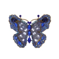 Close-up of vintage butterfly brooch with blue rhinestones and purple textured wings - Al1257-a