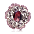 Vintage gold filigree flower brooch featuring a deep red center stone and purple accents - Dark Red