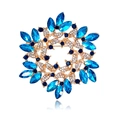 Detailed view of luxury blue crystal wreath brooch with gold setting and floral design - Royal Blue (Gold Base)