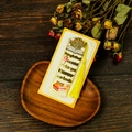 Detail of golden hollow metal bookmark with yellow tassel and inspirational quote - Things that could Make you Happy Style (T01042563)