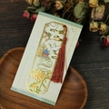 Detail of a vintage Chinese hollow metal bookmark with crane motif and red silk tassel - Crane Pavilion Style (T01042522)