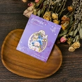 Macro detail of vintage floral metal bookmark with butterfly accents on wooden tray - Blue and Pink Flowers Style (T01042620)