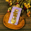 Detailed view of a gold hollow metal bookmark with cat illustration and brown tassel - Cat and Book Stack Design (T01042626)