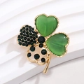 Macro detail of a green four-leaf clover brooch with rhinestones and cat-eye stone - Gold with Green Cat's Eye and Rhinestones (XZ186)
