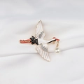 Close-up of crane brooch with enamel finish and white teardrop pearl on silk background - Stretched Pose Style (XZ2203-2)
