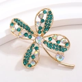 Macro view of gold flower brooch with green crystals and rainbow rhinestones - Gold Hollow with Cyan and AB Rhinestones (XZ178)
