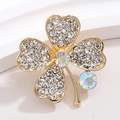 Detailed macro view of gold four-leaf clover brooch featuring iridescent crystals and rhinestones - Gold with White and AB Rhinestones (XZ184)