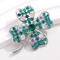 Detailed close-up of a silver four-leaf clover brooch with green and iridescent crystals - Silver Pave with Dark Green and AB Rhinestones (XZ179)