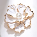 Detailed close-up of a white flower brooch with a central pearl and gold metallic edging - White Pleated Floral (XZ157)