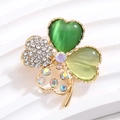 Golden clover brooch with green opal and sparkling crystals on a white background - Gold Multi-material Inlay with AB Center Stone (XZ188)