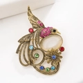 Vintage gouden feniks broche met kleurrijke kristallen en ovale kattenoogsteen - Vintage Goud Roze